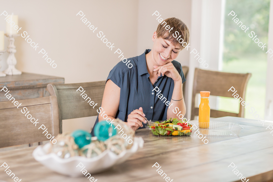 A young lady having a healthy meal stock photo with image ID: e604f20a-28d0-4460-9a4d-9cf2ae6b7b73