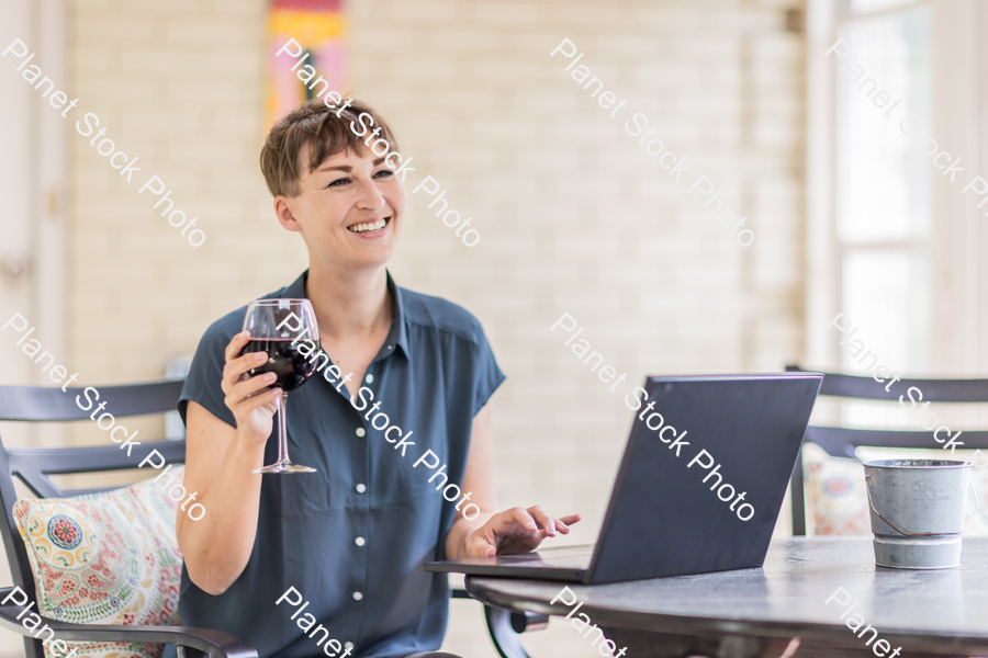 A young lady enjoying daylight at home stock photo with image ID: e6a6606a-51c4-43c4-b885-3fce00a98138