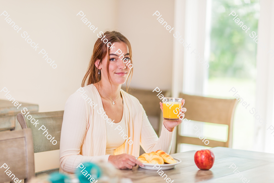 A young lady having a healthy breakfast stock photo with image ID: e7a0c9dc-7ca1-4b5f-8d4b-2ebfe87c3a98