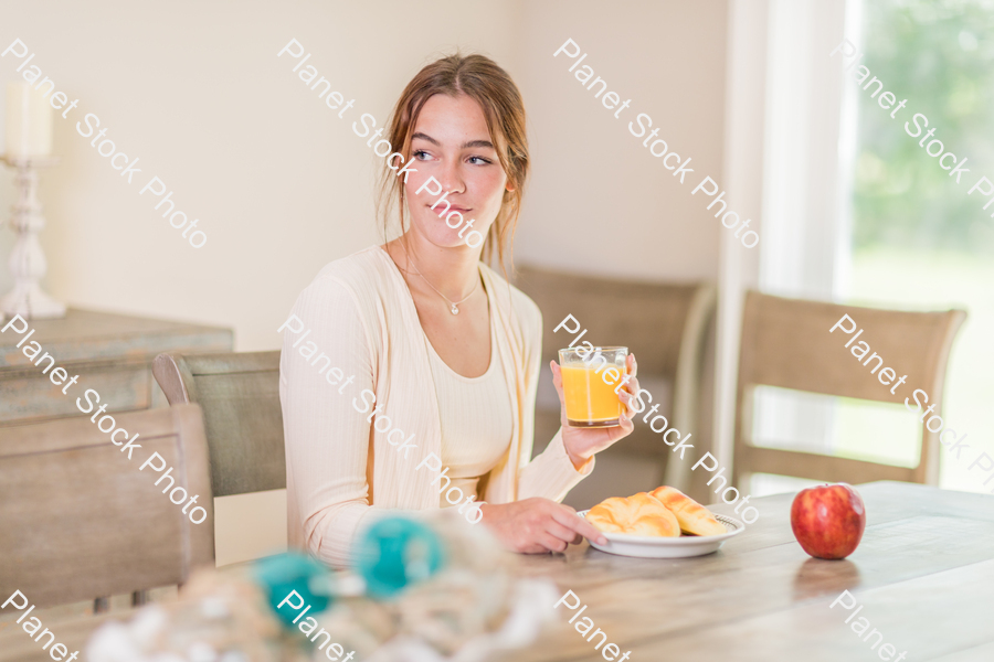 A young lady having a healthy breakfast stock photo with image ID: e809b665-abab-4f70-a373-15d08bfa4825