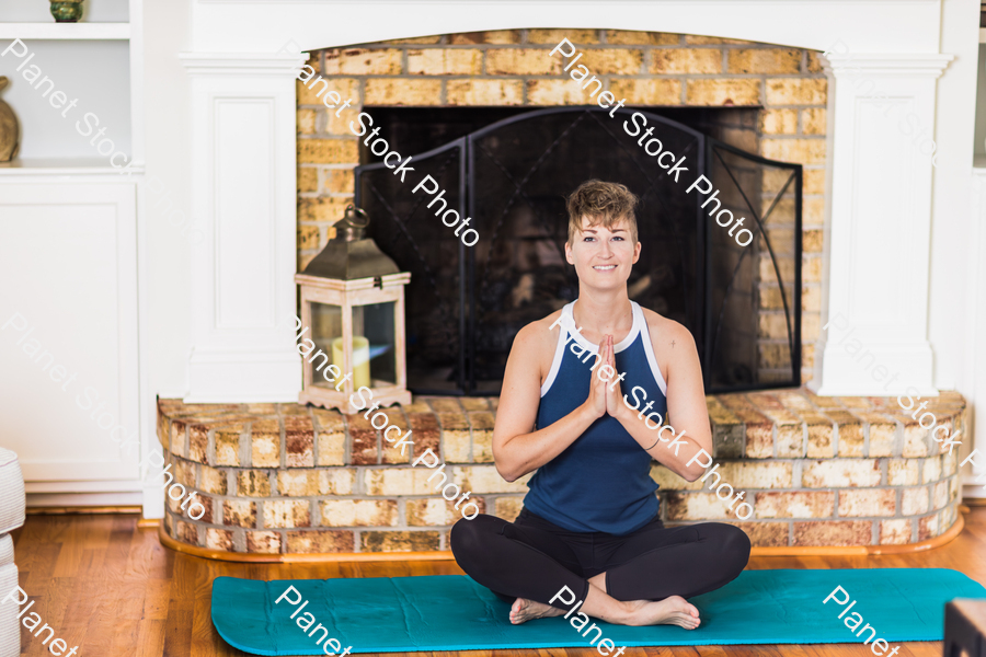 A young lady working out at home stock photo with image ID: e859000b-6c53-4f83-8cbe-0031a218bb31