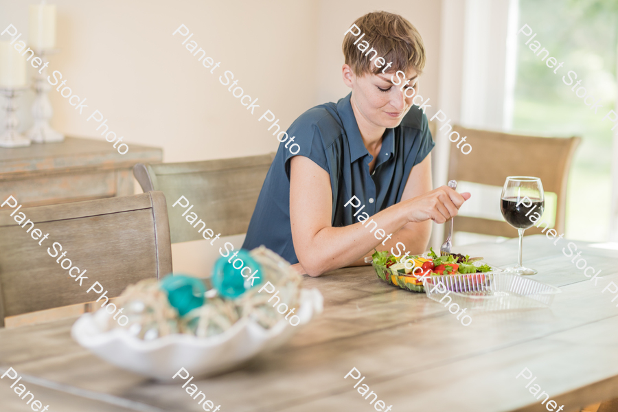 A young lady having a healthy meal stock photo with image ID: e9151f39-3771-46dd-b0f5-2e907e9d5486