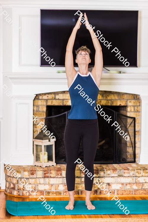 A young lady working out at home stock photo with image ID: e91cc339-e7e0-450c-9034-96170350fd9b