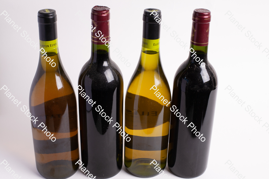 Four bottles of wine stock photo with image ID: e9ed1258-ec08-4c4e-bc56-f6ae42e3d202
