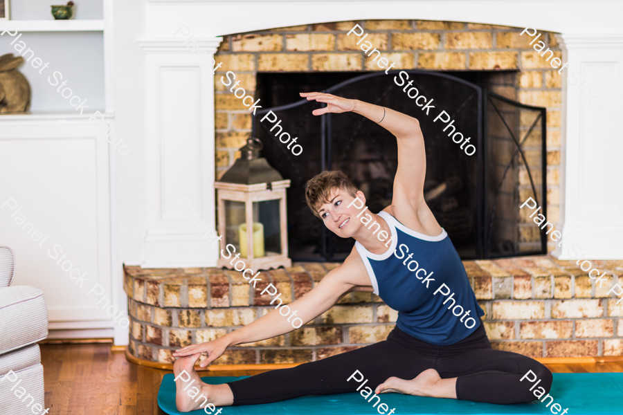A young lady working out at home stock photo with image ID: eef36dca-1994-4a47-8f65-8ae56a93e46b