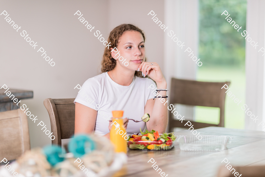 A young lady having a healthy meal stock photo with image ID: f1f06e42-4c56-45d2-8b74-fc752b6cba2c