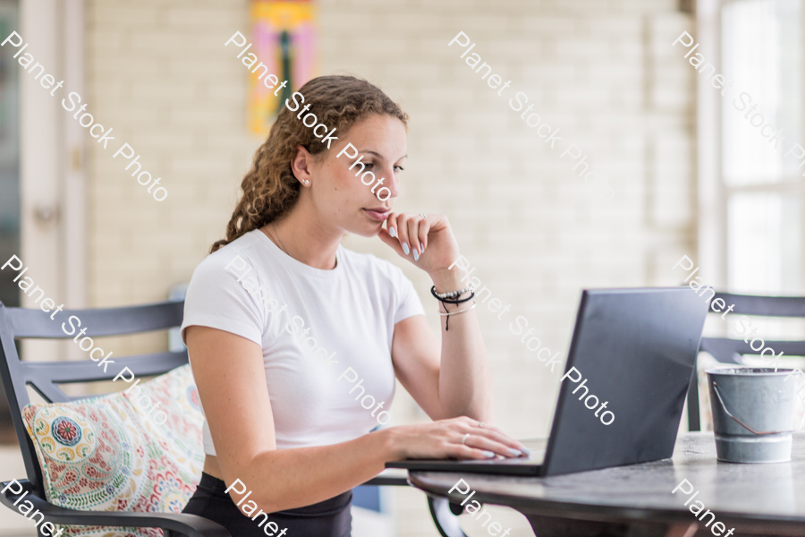 A young lady enjoying daylight at home stock photo with image ID: f5e316e2-1a75-4e3a-96e6-a720a28fdc62