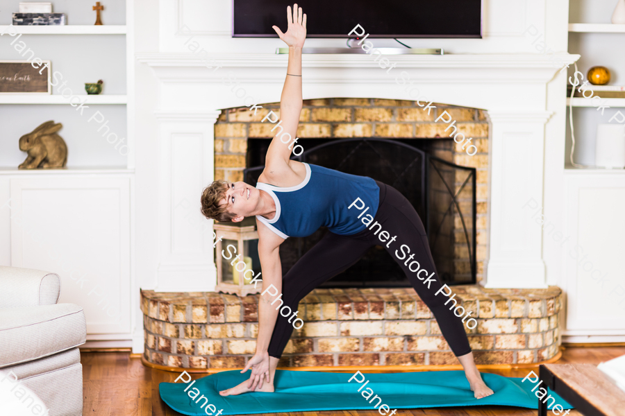 A young lady working out at home stock photo with image ID: f6d4d182-d7fa-4d57-9b3f-fa0968f6238f