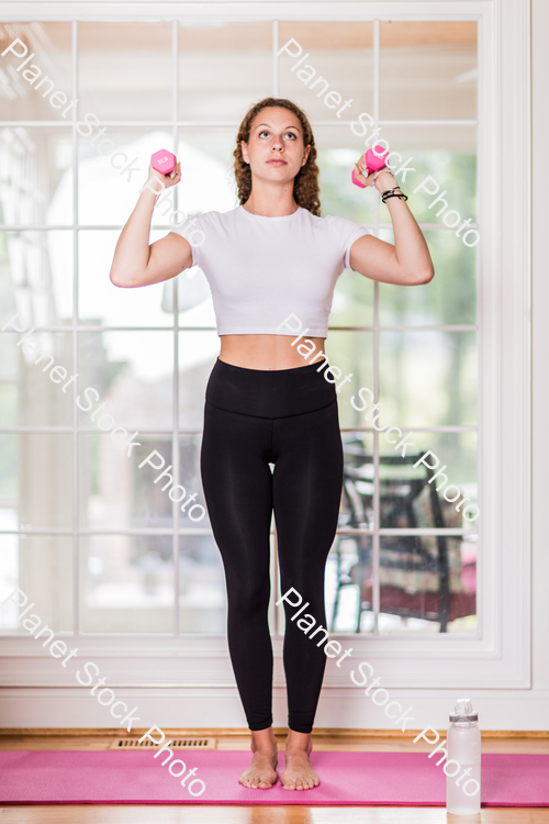 A young lady working out at home stock photo with image ID: f731662a-bcfe-4ed1-8241-3584d98b843a