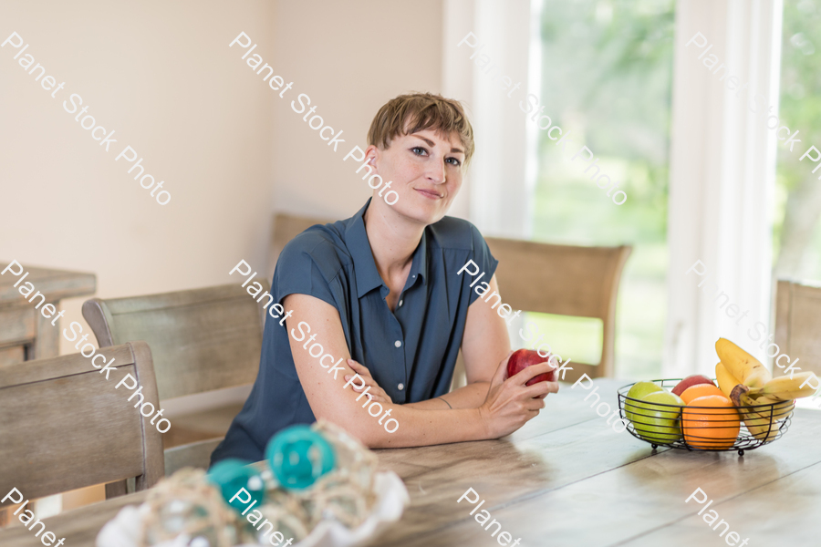 A young lady grabbing fruit stock photo with image ID: f95bb609-3548-462b-9f69-cc132c72e8a5