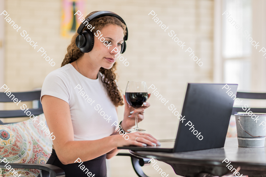 A young lady enjoying daylight at home stock photo with image ID: f9a24b88-54aa-4a29-8551-2d47994279a1