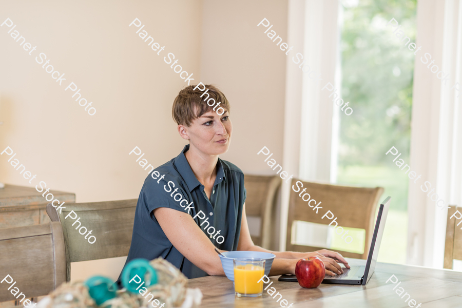 A young lady having a healthy breakfast stock photo with image ID: f9a628b3-85e8-4c11-a22a-850b0b0fe527