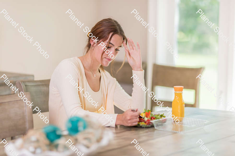A young lady having a healthy meal stock photo with image ID: fa64d036-770a-4cb3-b55b-8cff60672650