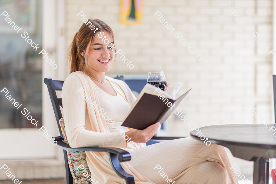 A young lady enjoying daylight at home stock photo with image ID: fd1b63c5-e1fa-4b77-8ada-b712df45c4ac