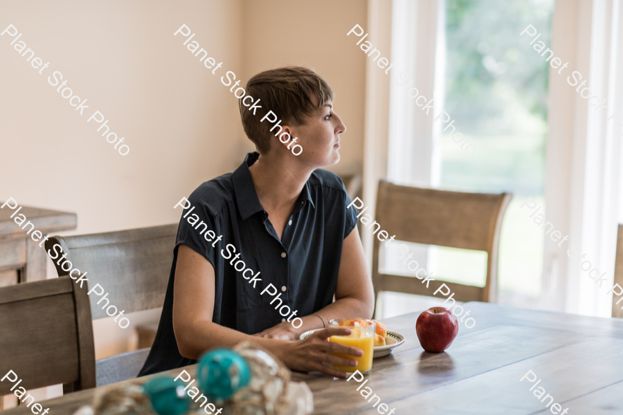 A young lady having a healthy breakfast stock photo with image ID: fdab24f9-74c4-44fc-9ca0-fd07b1c7b8df