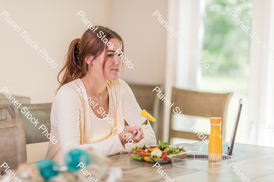 A young lady having a healthy meal stock photo with image ID: fdd0c31c-522b-41c5-9371-11bedfc2c264