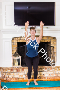 A young lady working out at home stock photo with image ID: 0a9ec0e6-5c9c-40aa-93ac-cc0e04a391b2