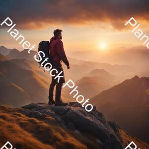 A Man Standing on the Top of a Mountain stock photo with image ID: 16bcd6ce-2c60-47f6-b19a-34d825aacfb0