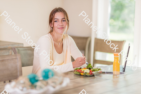 A young lady having a healthy meal stock photo with image ID: 1afb8aa4-68f1-48cd-abd3-47d635b5e2b6