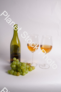 One bottle of white wine, with wine glasses, and grapes stock photo with image ID: 1de6baa8-a657-48ee-9766-cfd444c8b272