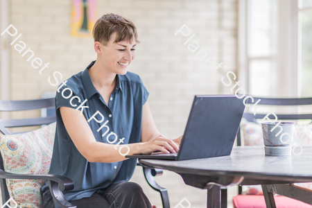 A young lady enjoying daylight at home stock photo with image ID: 2461891d-d070-48ff-aeed-beab27f8292b