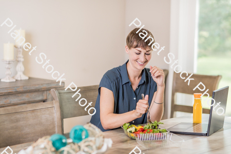 A young lady having a healthy meal stock photo with image ID: 2b3e9b87-1de0-447c-9fca-9eec078e5b27