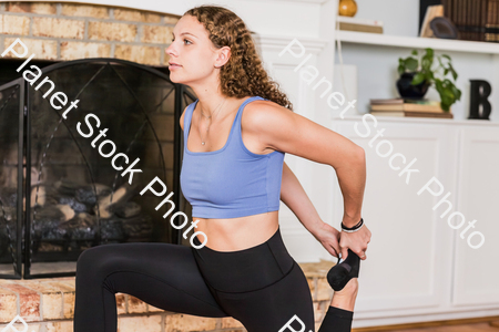 A young lady working out at home stock photo with image ID: 2c04f1ad-ba31-4cff-b56e-2aa0195bf1d0