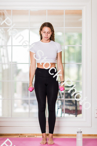 A young lady working out at home stock photo with image ID: 2fa5e6b2-ac6a-4521-a5f5-2e994e202a2e