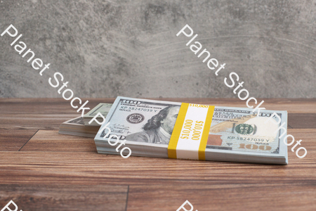 Three stacks of dollar bills stock photo with image ID: 31c147a4-00cc-4291-ba3a-9bc3ef7c3254