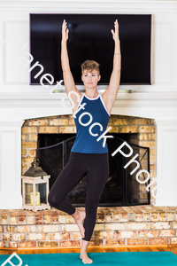 A young lady working out at home stock photo with image ID: 320f5e8f-b038-4166-b215-fbd44ef1d58f