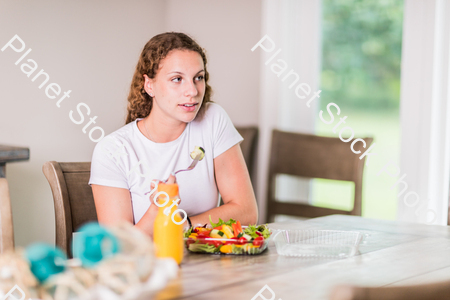 A young lady having a healthy meal stock photo with image ID: 321d1da1-81f7-4ed0-b06a-080e107e8ffd