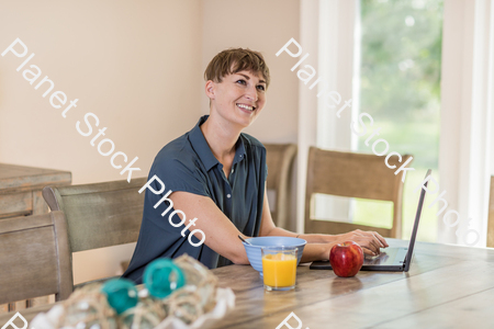A young lady having a healthy breakfast stock photo with image ID: 361e6e7c-8880-4089-8af2-e7a5228d537d