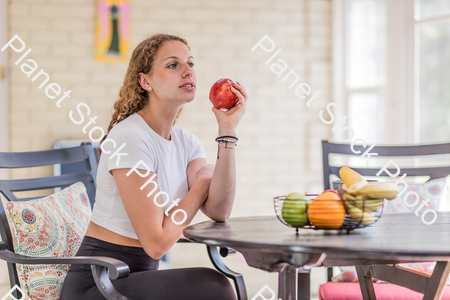 A young lady enjoying daylight at home stock photo with image ID: 36a1026b-9adb-4ddf-a7fa-f1faef200fe4