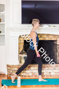 A young lady working out at home stock photo with image ID: 383caf87-c4d0-4e00-8484-2af0cd7fe45f