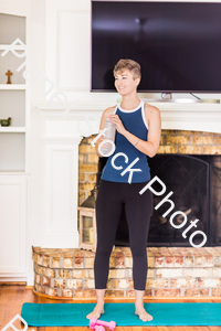 A young lady working out at home stock photo with image ID: 38d893dc-dd69-4b18-854e-6507f9177fb1