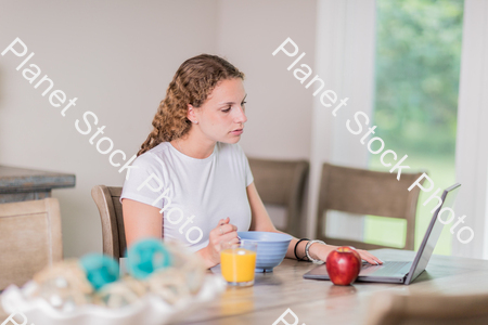 A young lady having a healthy breakfast stock photo with image ID: 3af75ebb-4216-47c8-8537-75292705842b