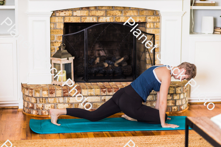 A young lady working out at home stock photo with image ID: 3ba11c80-1f48-4e23-9baa-0839a769ebc8