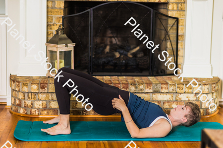 A young lady working out at home stock photo with image ID: 3e99a76b-7ff4-4a80-8f21-8b1bf3cb9e45