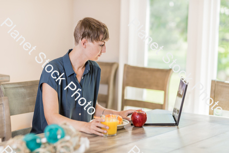 A young lady having a healthy breakfast stock photo with image ID: 43a14838-b7eb-43d1-b69c-bdc7dab7d8e9
