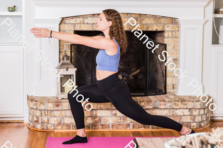 A young lady working out at home stock photo with image ID: 452bacf7-f726-4409-af2d-97bb473a7c8d