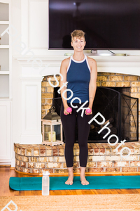 A young lady working out at home stock photo with image ID: 468b8e8d-27e5-4f95-a678-3345c5c9ec24