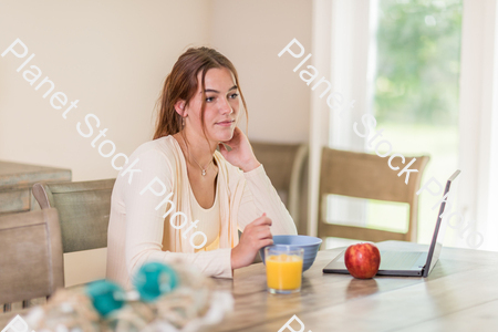 A young lady having a healthy breakfast stock photo with image ID: 538c856a-1d0b-47be-b819-85cb0d23a71f