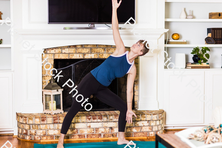 A young lady working out at home stock photo with image ID: 53d3eb16-2143-4003-9263-805e2db6f30f