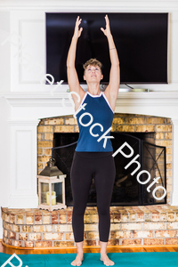 A young lady working out at home stock photo with image ID: 572b62c1-bff8-44b5-93d4-0d3b61e030c8