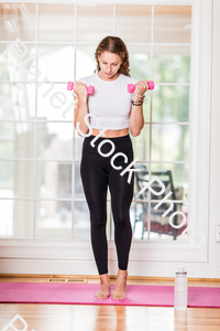 A young lady working out at home stock photo with image ID: 5c67e90a-d5ee-4077-a4fc-d36c0a8b1745