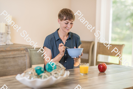 A young lady having a healthy breakfast stock photo with image ID: 5f286732-570f-4ab6-9e9a-1ec975f8ceb3
