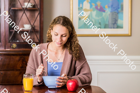 A young lady having a healthy breakfast stock photo with image ID: 615c2ab9-9b2b-442e-9f43-ee1b98001e43