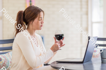 A young lady enjoying daylight at home stock photo with image ID: 620ab0d9-9c2e-45f7-8b80-99da2172a931