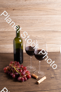 One bottle of red wine, with wine glasses, corkscrew, and grapes stock photo with image ID: 687c7698-7baa-4f48-be8b-08de623bafc7