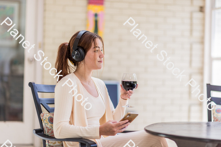 A young lady enjoying daylight at home stock photo with image ID: 6a104cba-e936-430c-85d8-6e7c25264d40